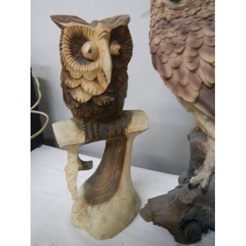 647 - A tall long eared owl (36 cm) and a smaller carved owl.