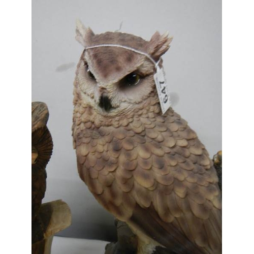 647 - A tall long eared owl (36 cm) and a smaller carved owl.