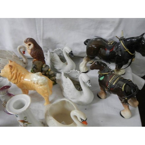 649 - 22 ceramic items including bisque swans, candlesticks etc.,