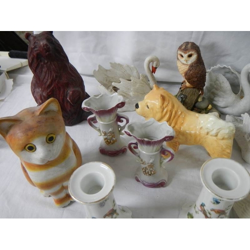 649 - 22 ceramic items including bisque swans, candlesticks etc.,