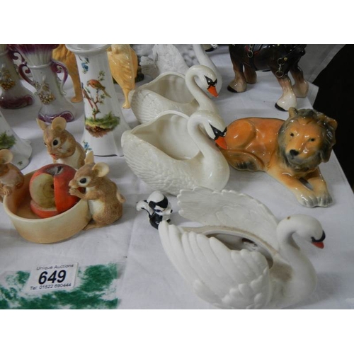 649 - 22 ceramic items including bisque swans, candlesticks etc.,