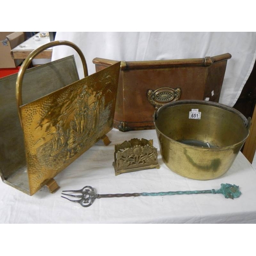 651 - A mixed lot of brass ware including magazine rack, jam pan, fire front etc.,