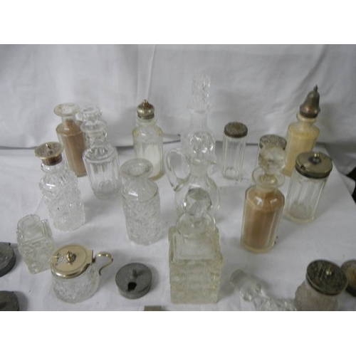 655 - A mixed lot of cruet bottles, inkwell tops, cruet tops etc.,