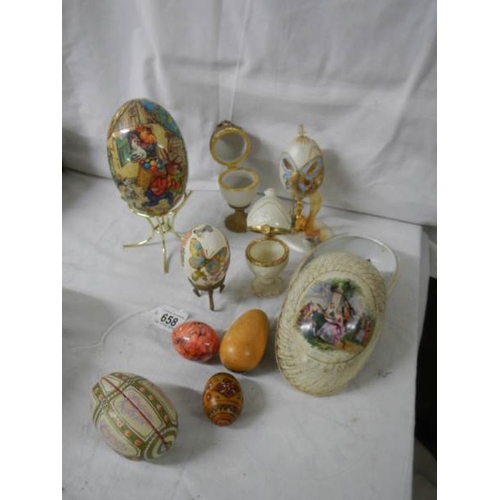 658 - A mixed lot of decorative collector's eggs in china and other materials.