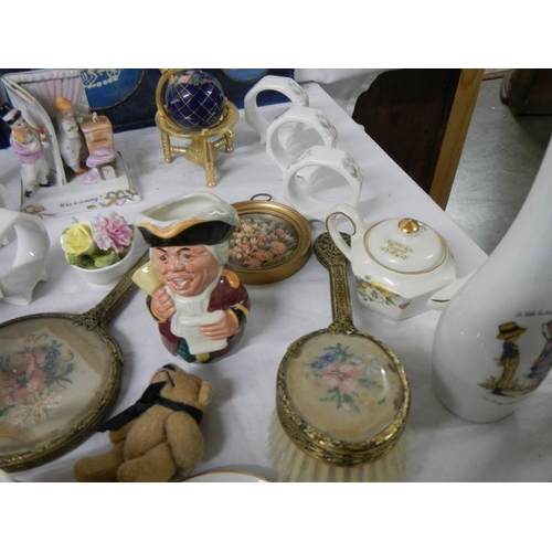 659 - A mixed lot of collectable ceramics etc., napkin rings, Poole, miniature world globe etc.,