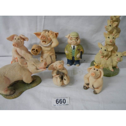 660 - 7 assorted pig figures.