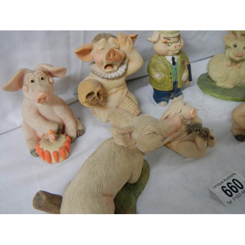 660 - 7 assorted pig figures.