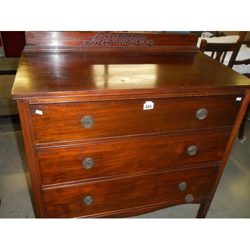 665 - A mahogany 3 drawer chest.