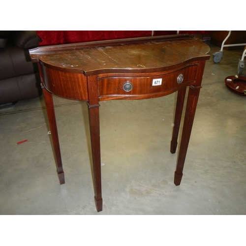 671 - A good mahogany serpentine front hall table.