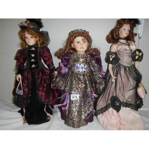 675 - 3 good collector's porcelain dolls.