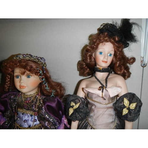 675 - 3 good collector's porcelain dolls.