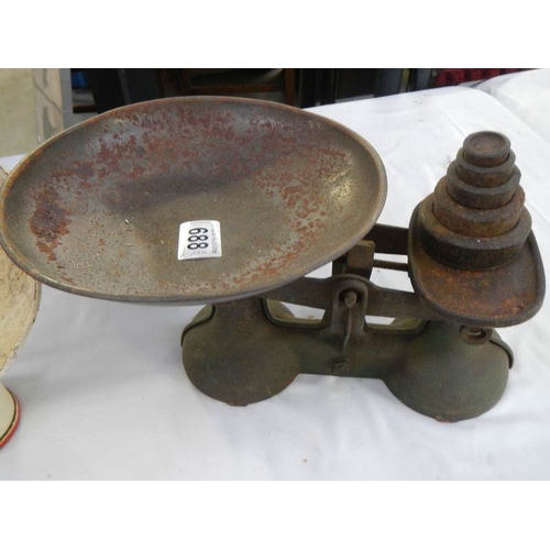 688 - 2 sets of kitchen scales with weights.