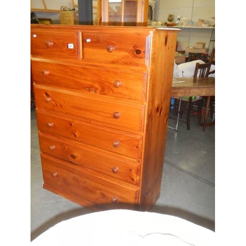 697 - A tall 5 drawer pine chest in very good condition.