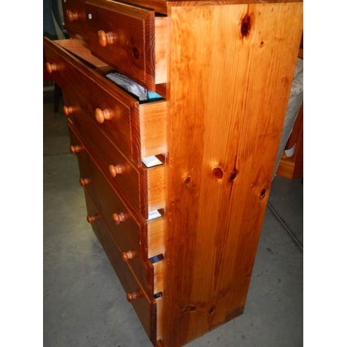 697 - A tall 5 drawer pine chest in very good condition.