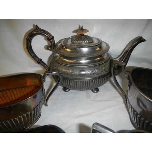 708 - A pewter teapot, 2 sugar bowls and 2 milk jugs.