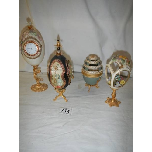 714 - 4 decorative collector's eggs in various materials.