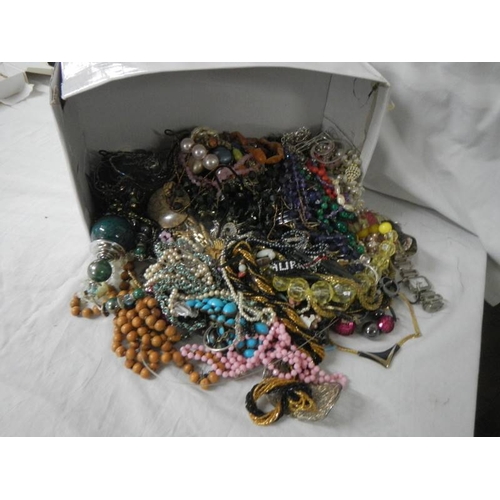 720 - A large mixed lot of costume jewellery.