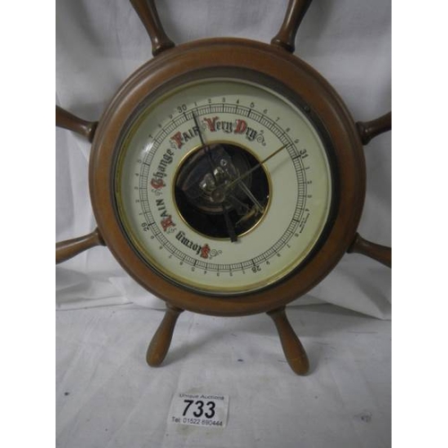 733 - A barometer in the shape of a ship's wheel, 30 cm diameters.