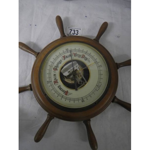 733 - A barometer in the shape of a ship's wheel, 30 cm diameters.