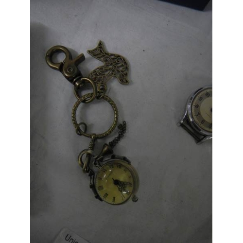 737 - A quantity of ladies and gents wrist watches, miniature ball clock etc.,