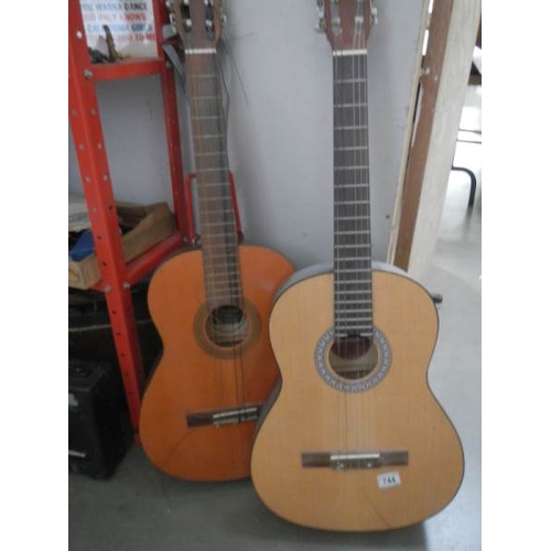 744 - A Dulcet classical guitar, an 'El Primo' guitar, a practice amp and a Lark cased violin.