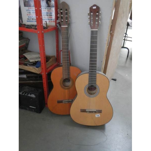 744 - A Dulcet classical guitar, an 'El Primo' guitar, a practice amp and a Lark cased violin.