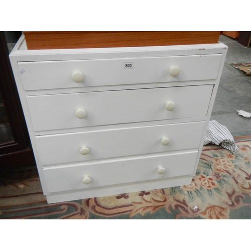 800 - A 4 drawer white painted chest.