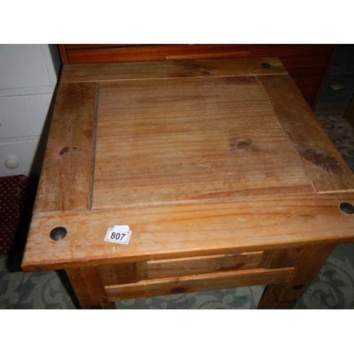 807 - A small rustic pine coffee table.