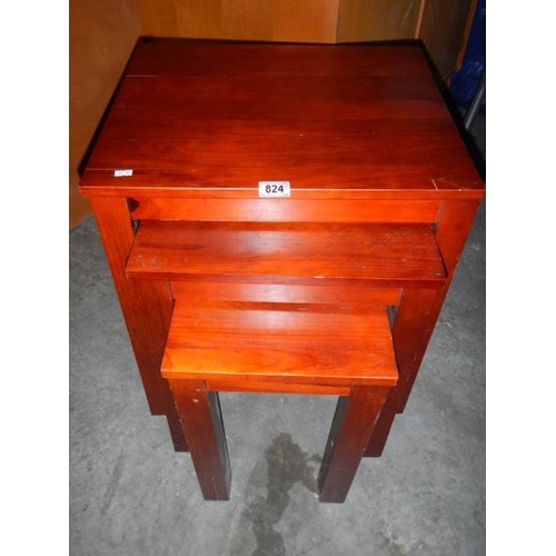 824 - A nest of 3 mahogany tables.