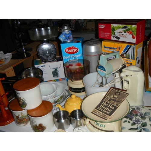 827 - A mixed lot of kitchen ware including scales, mixer etc.,