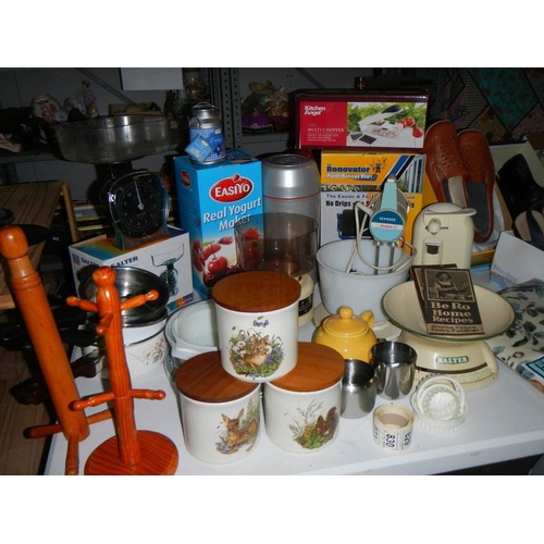 827 - A mixed lot of kitchen ware including scales, mixer etc.,