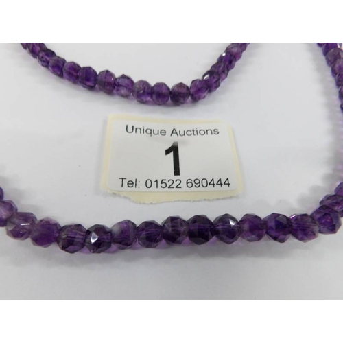 1 - A natural amethyst long necklace.