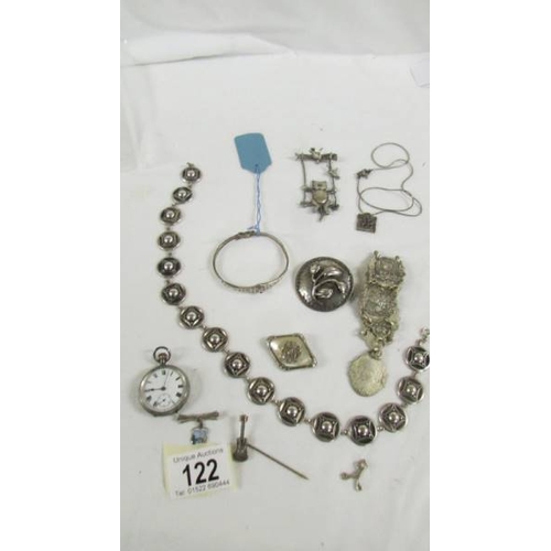 122 - A silver fob watch, a silver bangle and further jewellery items.
