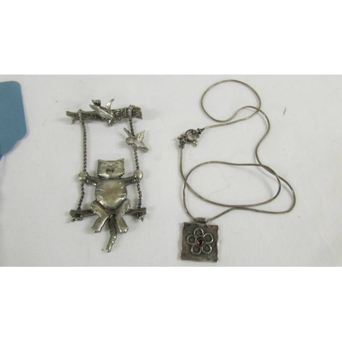 122 - A silver fob watch, a silver bangle and further jewellery items.