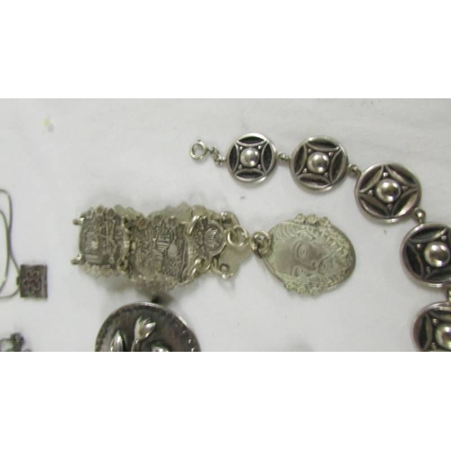 122 - A silver fob watch, a silver bangle and further jewellery items.