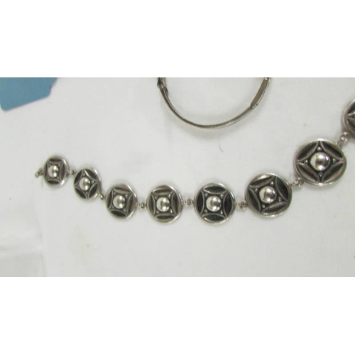 122 - A silver fob watch, a silver bangle and further jewellery items.