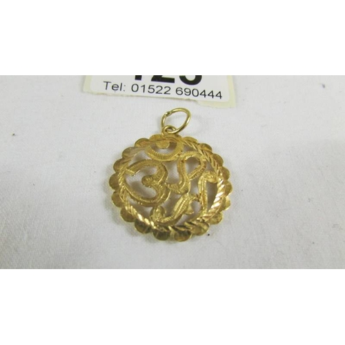 125 - A pendant (test and 24 ct gold) 2.6 grams.