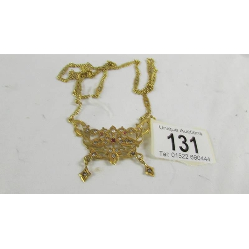 131 - A necklace on long chain, (tests as 24ct gold) 30 grams.