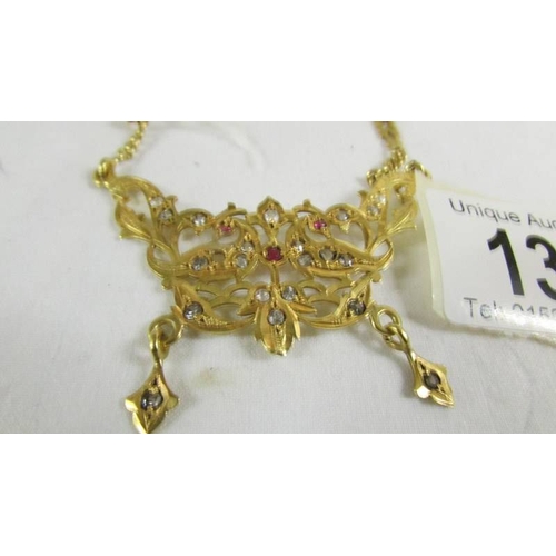 131 - A necklace on long chain, (tests as 24ct gold) 30 grams.