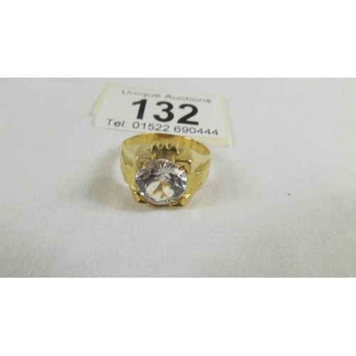 132 - A  ring set white stone (tests as 24 ct gold) size S.