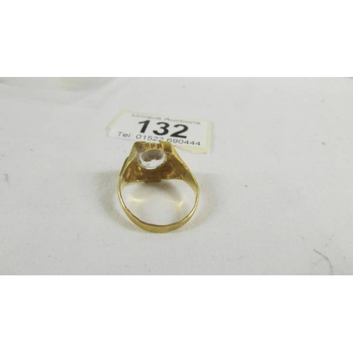 132 - A  ring set white stone (tests as 24 ct gold) size S.