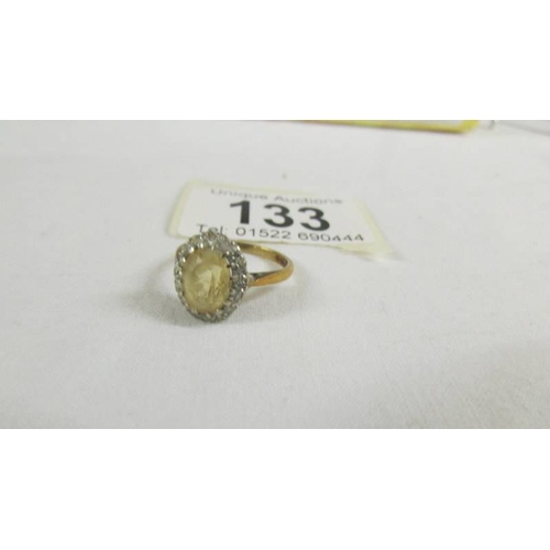 133 - A 9ct gold cluster ring, size K half.