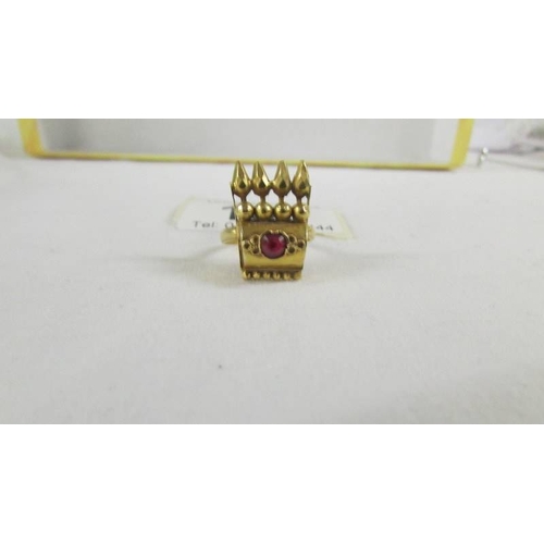 135 - A ring set red stone, size K, (tests as 24ct gold).