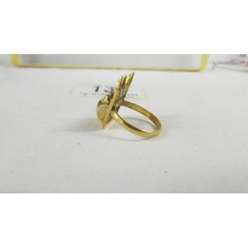 135 - A ring set red stone, size K, (tests as 24ct gold).