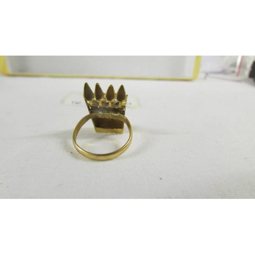 135 - A ring set red stone, size K, (tests as 24ct gold).