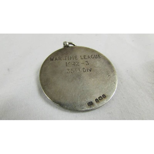 137 - A silver medallion (War Time League 1942-3, 35th Div.), a 1914-18 medal for 18413 Pte. L Hewitt H.R.... 