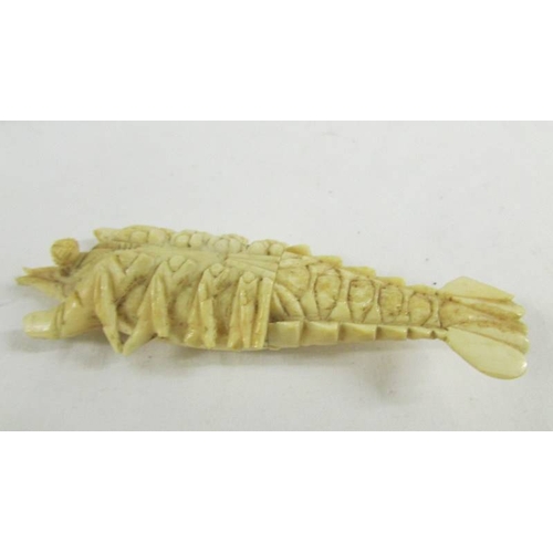 142 - A rare and unusual carved ivory lobster (a/f) and an ivory crochet hook.