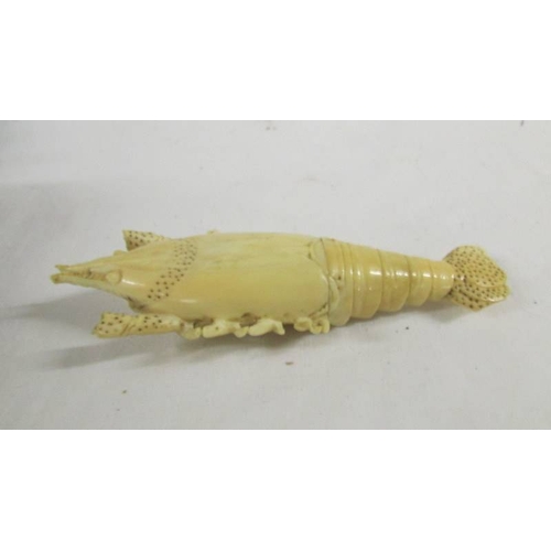 142 - A rare and unusual carved ivory lobster (a/f) and an ivory crochet hook.