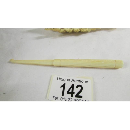 142 - A rare and unusual carved ivory lobster (a/f) and an ivory crochet hook.