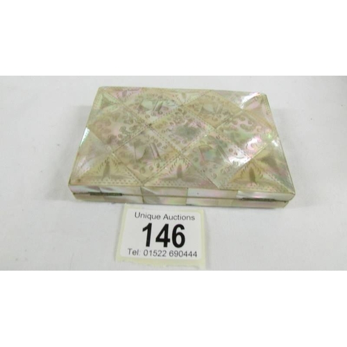 146 - A wallet type mother of pearl card case.